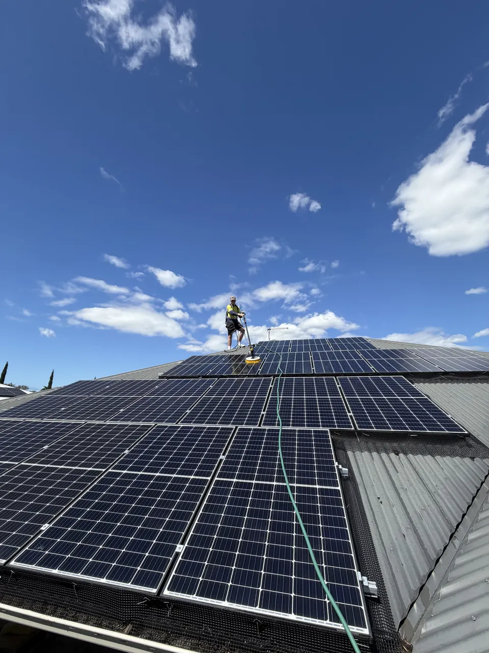 Solar Shine Co cleaning a rooftop array